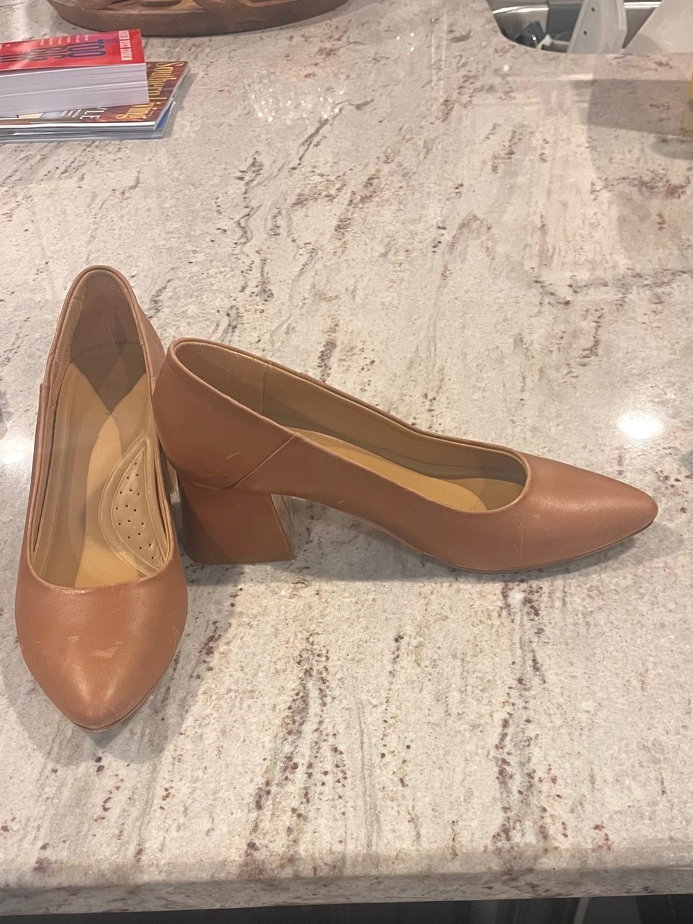 Nisolo women's flat crafted in brown leather.